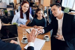 man woman and child speaking to a divorce lawyer in austin