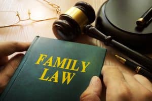 austin family law textbook closed with a gavel next to it