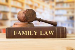austin texas family law textbook closed with a gavel on top of it