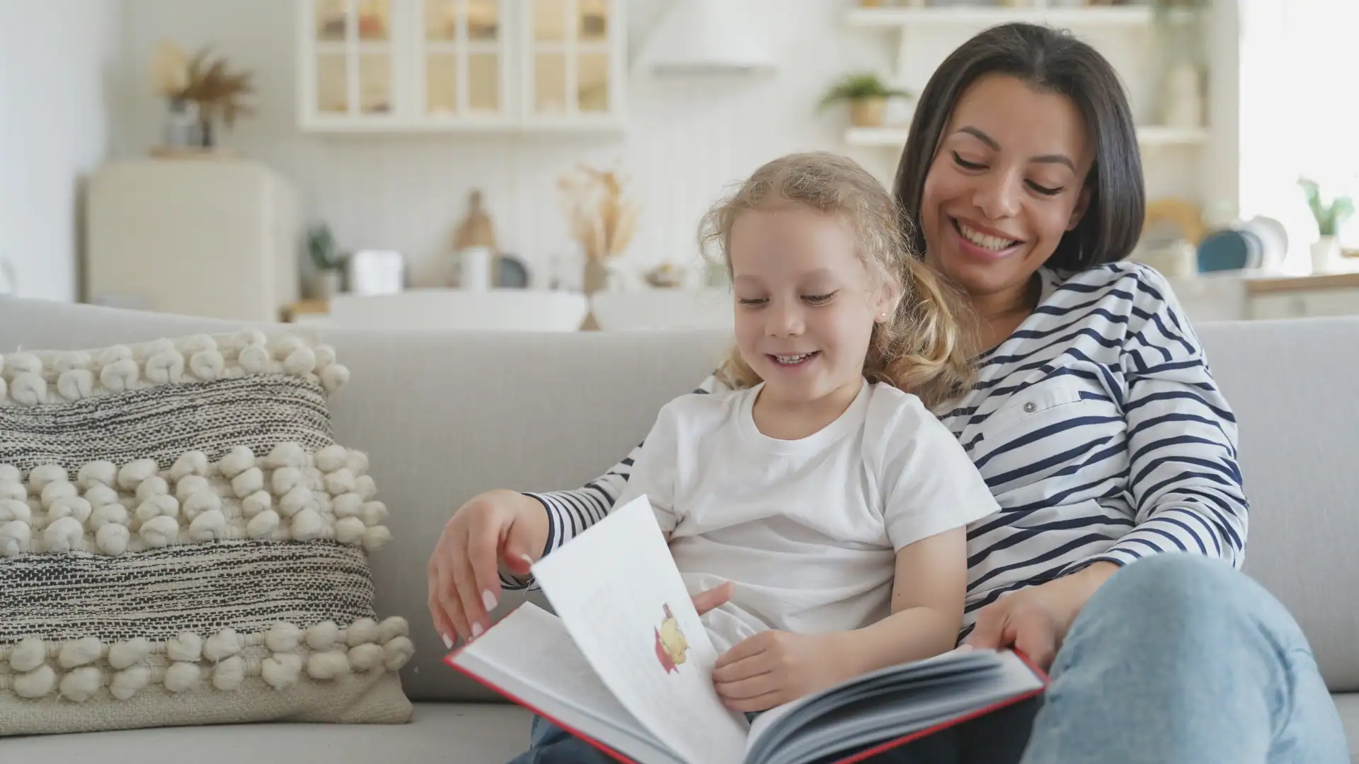 a woman reading a book with their adopted niece