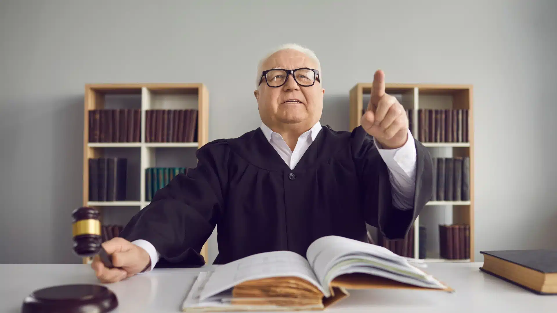 texas judge pointing at the audience and stating their ruling ina protection order hearing in texas