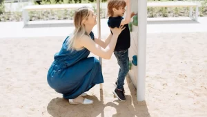 a mother playing with her child at a park in texas