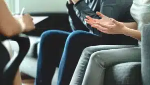 an upset couple discussing with a prenuptial lawyer in austin