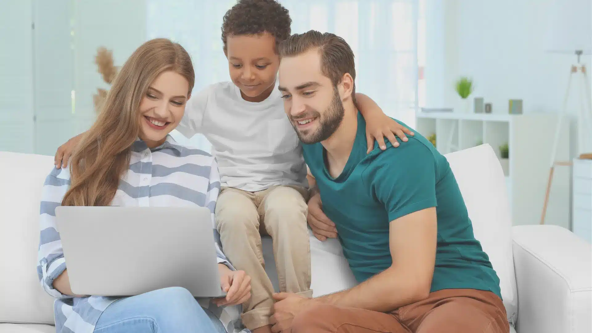 A family reviews What Will Disqualify You from Adopting a Child in Texas on there laptop