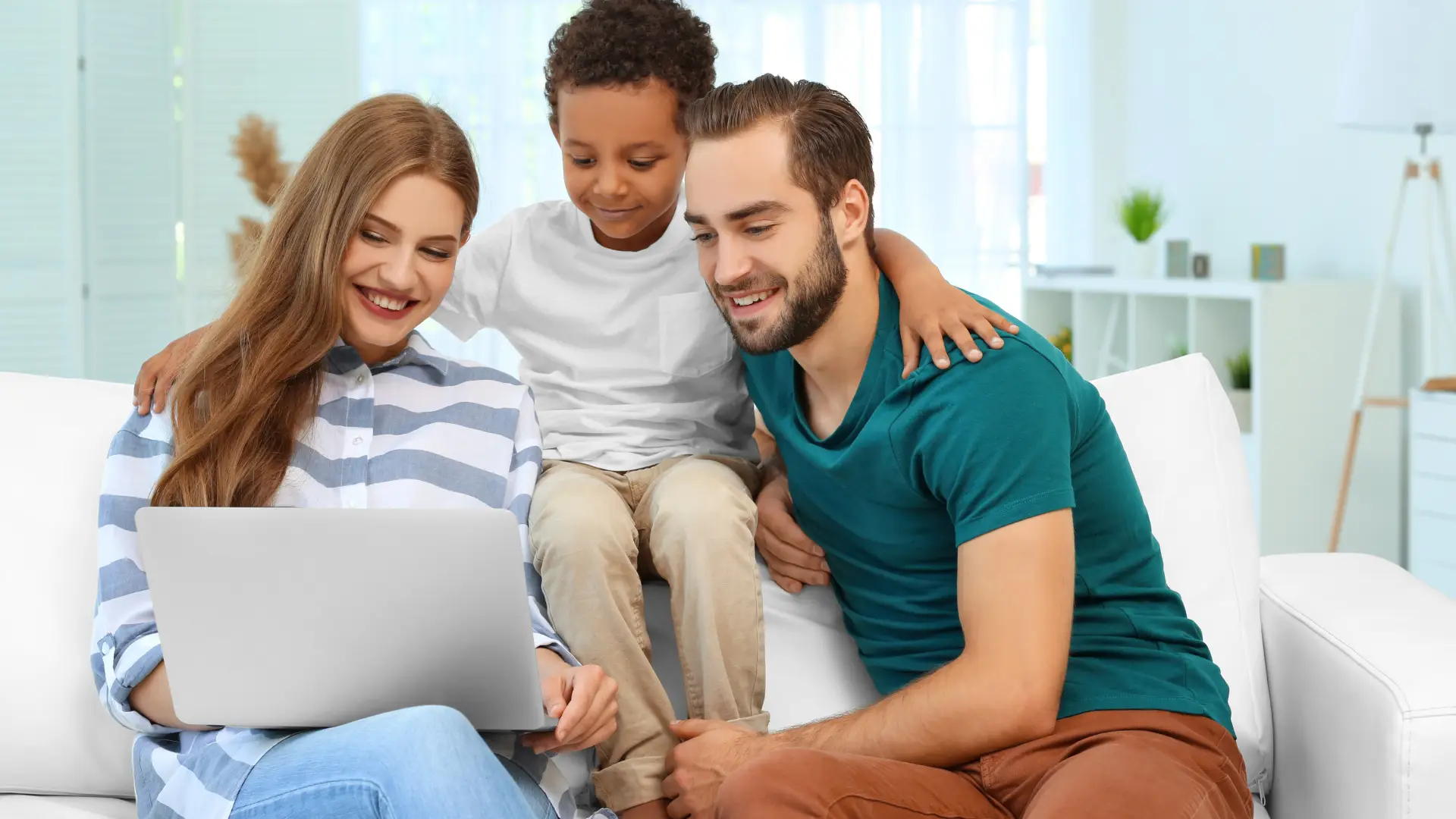 A family looking at the costs of adoption in texas on a laptop