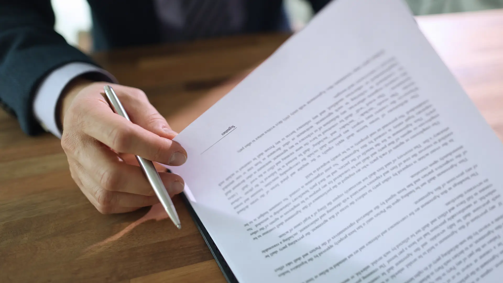 a person signing a document