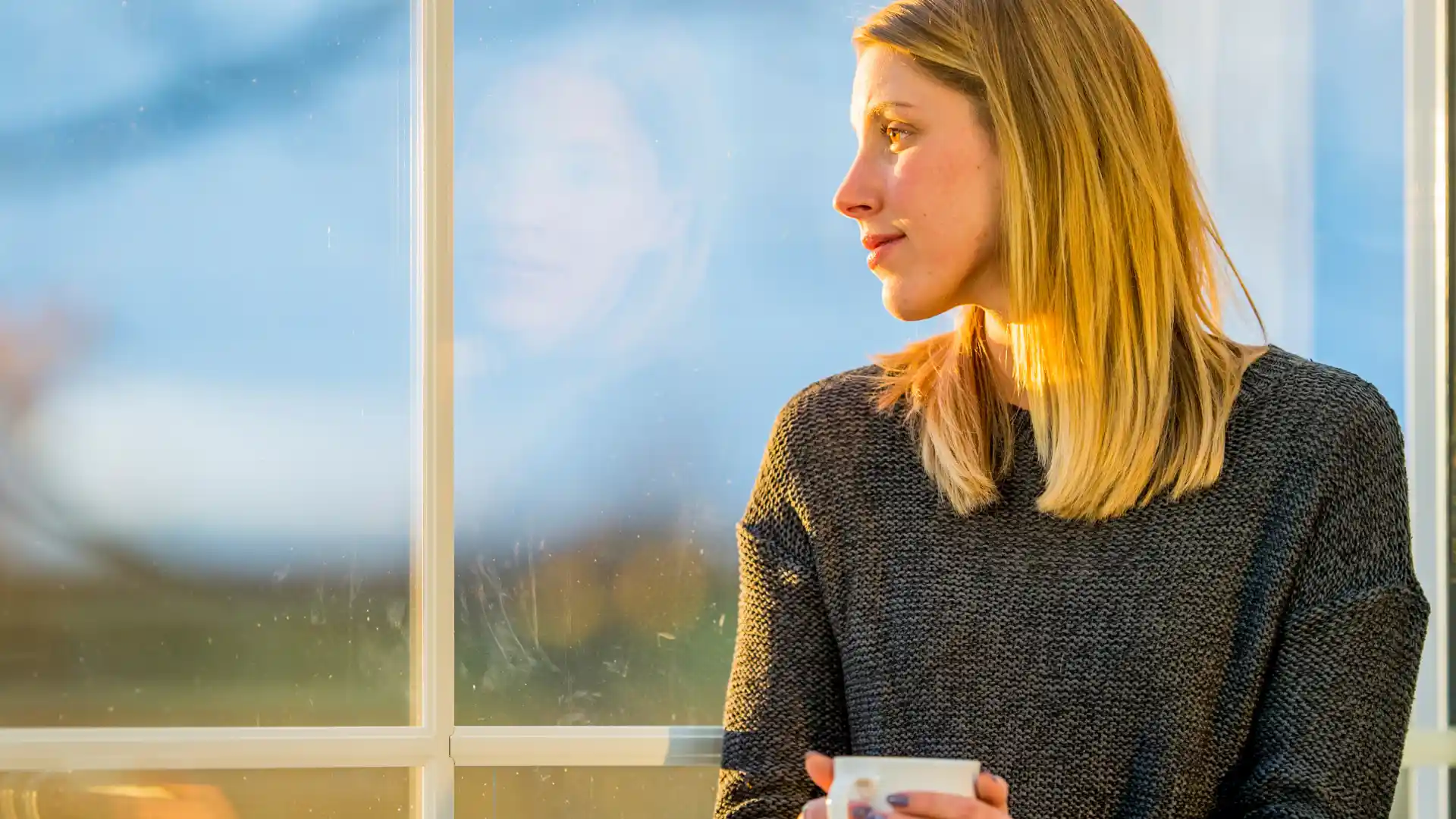 a woman looking out a window